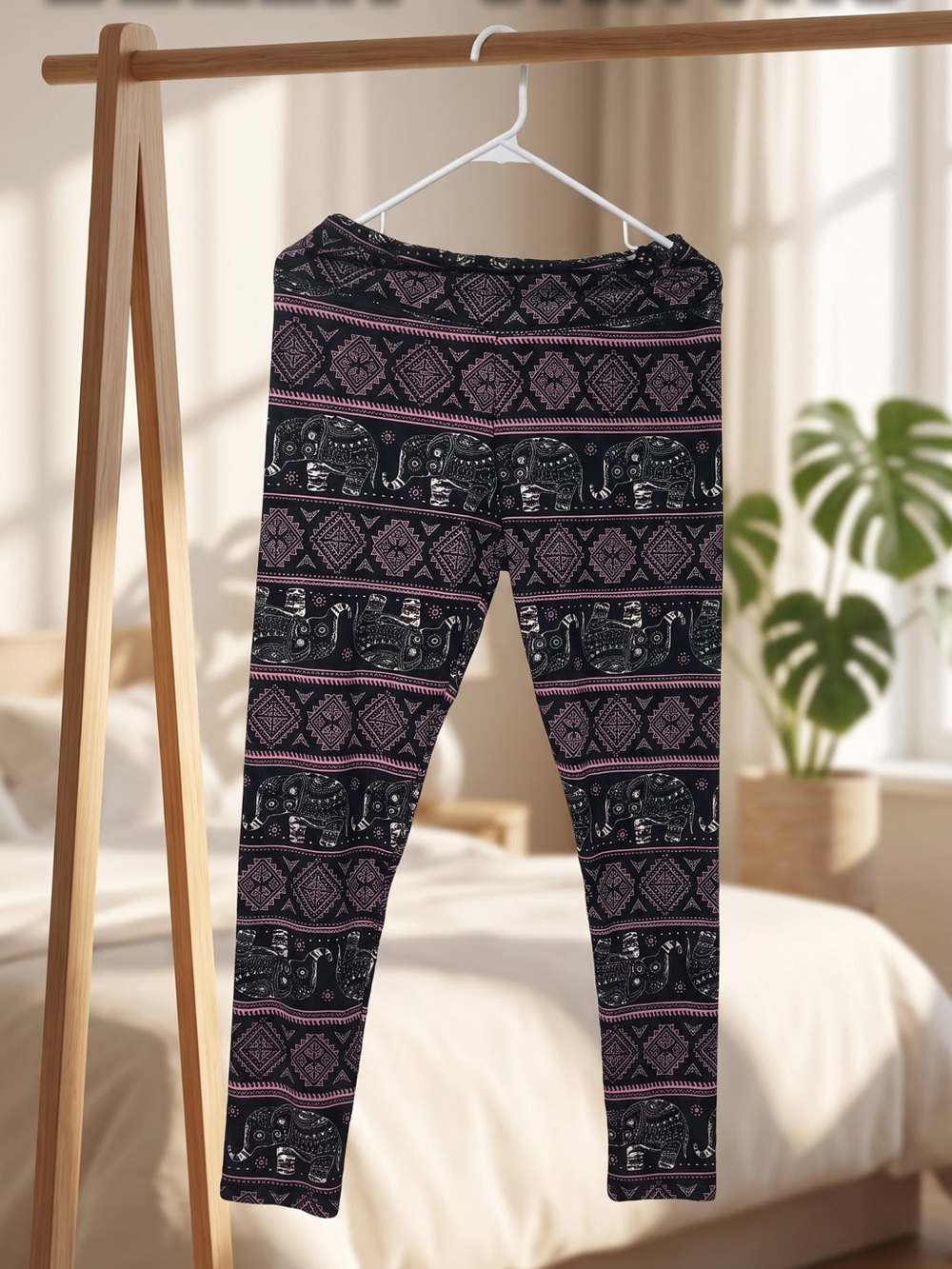 Women’s Black and Pink Elephant Print Leggings tag says plus size